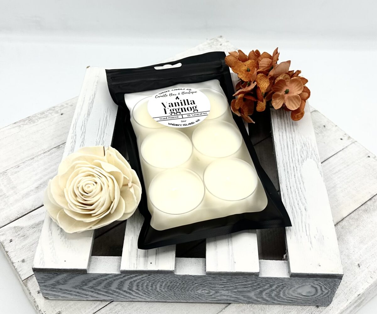 Tealights scented with vanilla eggnog fragrance, in a sealed black and clear pouch